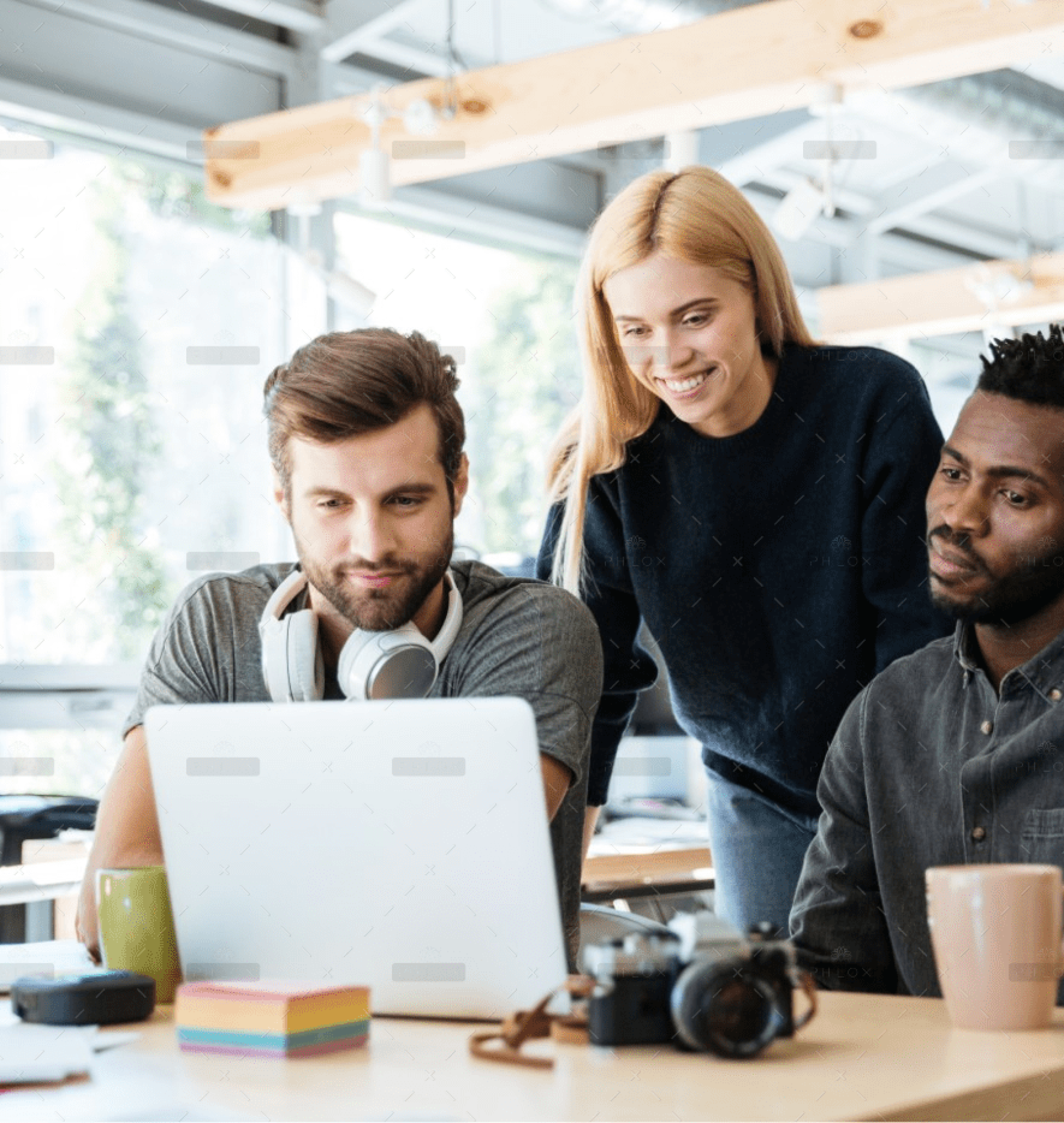 demo-attachment-57-happy-colleagues-sitting-in-office-coworking-PHYA6TG